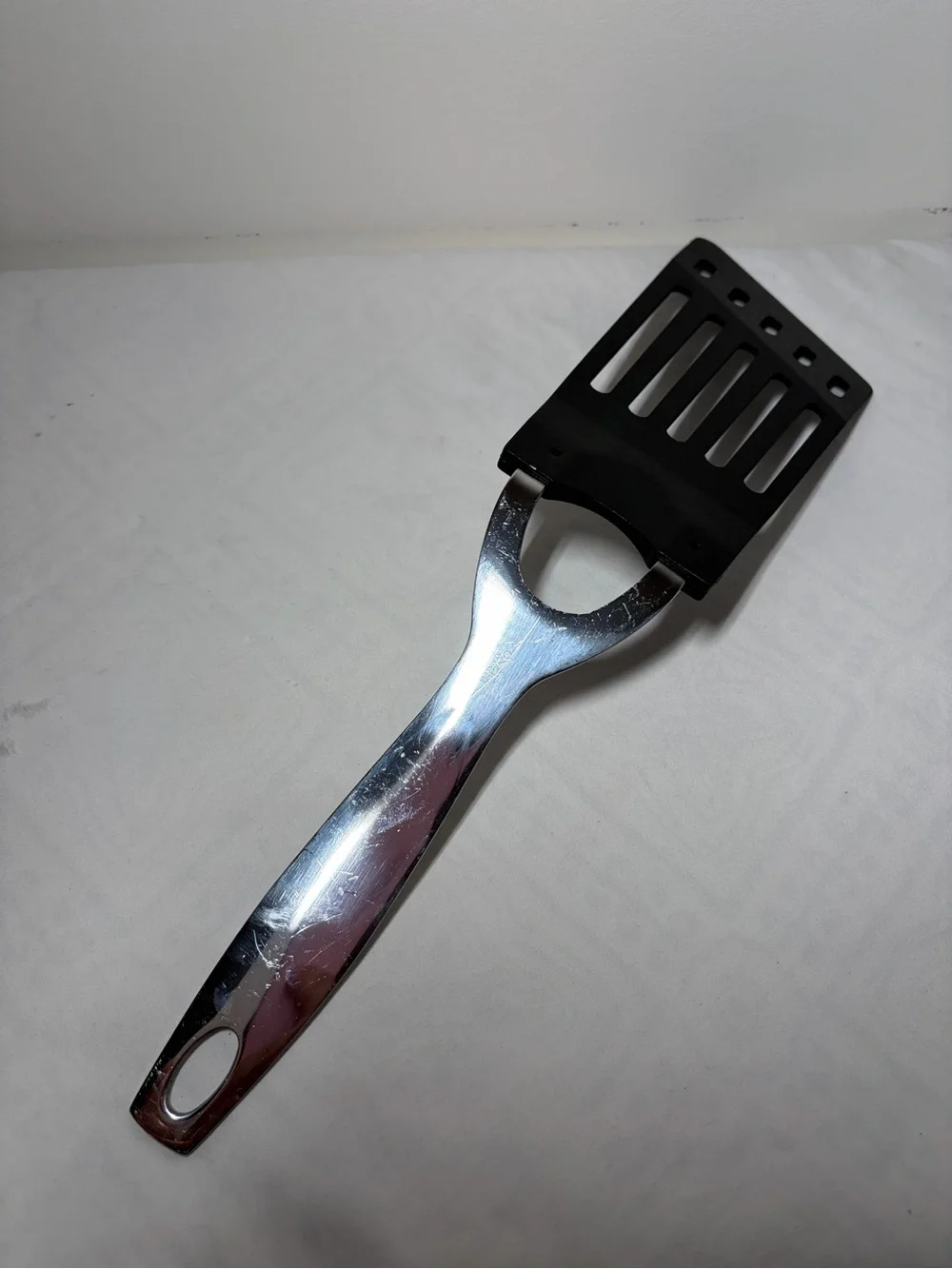 Oneida Black Nylon Slotted Turner Spatula with Stainless Steel Handle